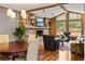 Comfortable living room next to dining area with fireplace, shelving and big windows at 2574 Sugarplum Ne Ct, Atlanta, GA 30345