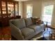 Bright living room featuring hardwood floors, a comfortable couch, and large windows for ample natural light at 2574 Sugarplum Ne Ct, Atlanta, GA 30345