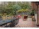 Brick patio area with outdoor seating and an adjacent backyard at 2574 Sugarplum Ne Ct, Atlanta, GA 30345