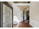 Inviting foyer with hardwood floors, wainscoting, and an arched entryway, creating an elegant first impression at 4205 Idlewood Dr, Cumming, GA 30040