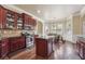 Lovely kitchen with dark wood cabinets, granite countertops, and stainless steel appliances at 4205 Idlewood Dr, Cumming, GA 30040