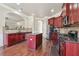 Kitchen features stainless steel appliances, an island, granite countertops, and hardwood floors at 4205 Idlewood Dr, Cumming, GA 30040