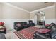 Comfortable living room featuring neutral walls, wainscoting, and an archway to the dining area at 4205 Idlewood Dr, Cumming, GA 30040