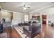 Bright living room with hardwood floors, wainscoting, staircase, and archways to other rooms at 4205 Idlewood Dr, Cumming, GA 30040