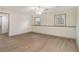 Bedroom with vinyl floors, neutral paint, and a ceiling fan with light fixture at 6645 Doublegate Ln, Rex, GA 30273