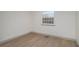 Bedroom with vinyl floors and a window at 6645 Doublegate Ln, Rex, GA 30273