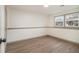 Bedroom with vinyl floors, neutral paint, and natural light from a window at 6645 Doublegate Ln, Rex, GA 30273