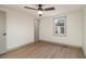 Bedroom features a ceiling fan, natural light, and sleek flooring at 6645 Doublegate Ln, Rex, GA 30273