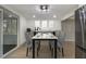 Dining area featuring modern furnishings, contemporary decor, and access to a screened in porch at 6645 Doublegate Ln, Rex, GA 30273