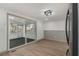 Bright dining room featuring sliding glass doors and modern wood-look floors at 6645 Doublegate Ln, Rex, GA 30273