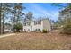 Inviting home featuring a well-kept lawn, fenced yard, and a welcoming front entrance at 6645 Doublegate Ln, Rex, GA 30273