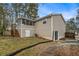 Rear view of the home featuring a screened porch, patio door, and fenced yard at 6645 Doublegate Ln, Rex, GA 30273