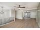 Open-concept living area with modern finishes and an adjacent sunroom at 6645 Doublegate Ln, Rex, GA 30273