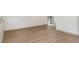 Bright living room featuring vinyl floors, neutral walls, and a sliding glass door at 6645 Doublegate Ln, Rex, GA 30273