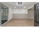 Bright living space featuring luxury vinyl flooring, screened porch, and modern finishes at 6645 Doublegate Ln, Rex, GA 30273