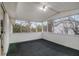 Screened porch with paneled walls and views of the trees at 6645 Doublegate Ln, Rex, GA 30273