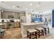 Well-equipped kitchen featuring stainless steel appliances, granite countertops, and breakfast bar at 6775 Marlow Dr, Cumming, GA 30041