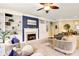 Comfortable living room with a fireplace, built-in shelving, and stylish furniture at 6775 Marlow Dr, Cumming, GA 30041