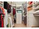 Walk-in closet with custom shelving, drawers, and ample hanging space for optimal organization at 6775 Marlow Dr, Cumming, GA 30041