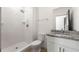 Bathroom featuring a subway-tiled shower and granite countertop vanity at 1092 Wedgewood Nw Dr, Atlanta, GA 30318