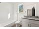 Bright bathroom featuring subway tile, and a granite countertop at 1092 Wedgewood Nw Dr, Atlanta, GA 30318