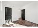 Bedroom with a view to another room, a window, and wood-look floors at 1092 Wedgewood Nw Dr, Atlanta, GA 30318