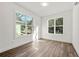 Bright bedroom featuring two large windows that provide abundant natural light and wood-look floors at 1092 Wedgewood Nw Dr, Atlanta, GA 30318