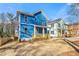 New construction home features a welcoming porch with light blue facade and professional yard grading at 1092 Wedgewood Nw Dr, Atlanta, GA 30318