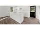 Modern kitchen features a stylish island, sleek white cabinets, and contemporary fixtures at 1092 Wedgewood Nw Dr, Atlanta, GA 30318