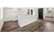 Bright, open kitchen with a large island, modern appliances, and stylish wood-look flooring at 1092 Wedgewood Nw Dr, Atlanta, GA 30318