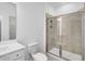 Stylish bathroom featuring a glass shower, white vanity, and modern fixtures at 1466 Auburn Glen Rd, Dacula, GA 30019