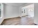 Bright and airy dining room features modern chandelier, large windows, and hardwood floors at 1466 Auburn Glen Rd, Dacula, GA 30019