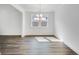 Elegant dining room features modern lighting fixture and large window, on top of hardwood floors at 1466 Auburn Glen Rd, Dacula, GA 30019