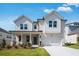 Charming two-story home with a landscaped front yard, brick facade and a two-car garage at 1466 Auburn Glen Rd, Dacula, GA 30019
