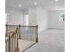 Open loft area featuring a dark metal railing at 1466 Auburn Glen Rd, Dacula, GA 30019