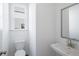 A modern powder room with a stylish sink and fixtures at 1466 Auburn Glen Rd, Dacula, GA 30019