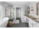 Bright bathroom featuring a soaking tub, glass shower, and double vanity with granite countertops at 3321 Spindletop Nw Dr, Kennesaw, GA 30144