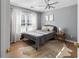 Stylish bedroom features a gray color scheme, hardwood floors, and natural lighting at 3321 Spindletop Nw Dr, Kennesaw, GA 30144