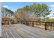 Large wooden deck overlooking trees, perfect for outdoor entertaining at 3321 Spindletop Nw Dr, Kennesaw, GA 30144