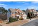 View of a brick two-story home with vinyl siding, a two-car garage, and manicured landscaping at 3321 Spindletop Nw Dr, Kennesaw, GA 30144