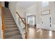 Spacious open foyer with hardwood floors, staircase, and ample natural light at 3321 Spindletop Nw Dr, Kennesaw, GA 30144