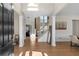 Elegant foyer with hardwood floors, staircase, white pillars and abundant natural light at 3321 Spindletop Nw Dr, Kennesaw, GA 30144