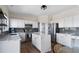 Bright kitchen with stainless steel appliances, gray backsplash, white cabinets, and a kitchen island at 3321 Spindletop Nw Dr, Kennesaw, GA 30144
