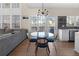 Eat-in kitchen featuring white cabinets, stainless steel appliances, and a view of the living room at 3321 Spindletop Nw Dr, Kennesaw, GA 30144