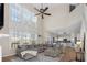 Spacious living room with a vaulted ceiling, many windows, and a comfortable gray sectional sofa at 3321 Spindletop Nw Dr, Kennesaw, GA 30144