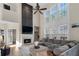 Inviting living room with a fireplace, a large window and comfortable seating at 3321 Spindletop Nw Dr, Kennesaw, GA 30144