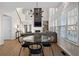Open-concept eat-in kitchen and living room with vaulted ceiling, fireplace, and a large window at 3321 Spindletop Nw Dr, Kennesaw, GA 30144