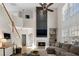 Inviting living room featuring a fireplace, vaulted ceiling, and a staircase leading to the second floor at 3321 Spindletop Nw Dr, Kennesaw, GA 30144