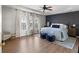 Spacious primary bedroom with natural lighting, tray ceilings and hardwood floors at 3321 Spindletop Nw Dr, Kennesaw, GA 30144