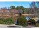 Enjoy picturesque pond views surrounded by mature trees and lush greenery at 3321 Spindletop Nw Dr, Kennesaw, GA 30144